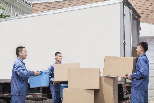 Loading furniture into a van for an Earls Court house move