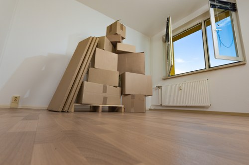 Student removals moving boxes in Earls Court streets