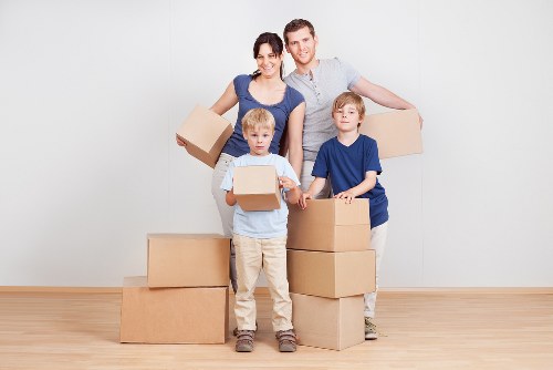 Removal team loading boxes and furniture for an Earls Court property move