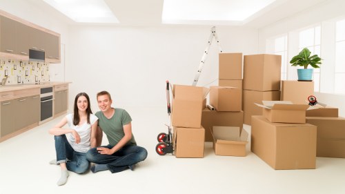 Mover assessing stairs and access points before handling furniture