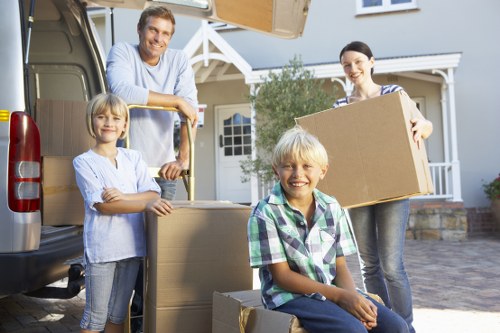 Local moving team loading furniture for an Earls Court collection