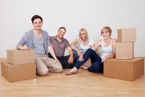 Professional movers securing boxes and furniture for safe transport