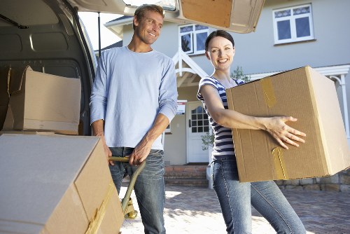 Removal workers loading items carefully for an Earls Court apartment move